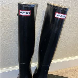 Black tall hunter boots
